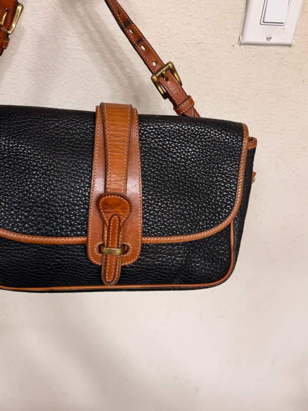 Dooney & Bourke Black with Brown Trim Pebbled Leather Crossbody Bag